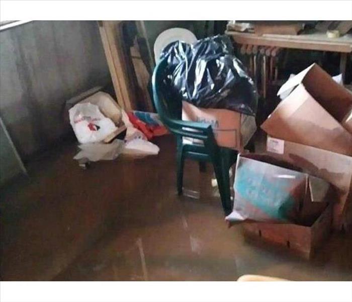 wet cartons, items in water covered basement floor