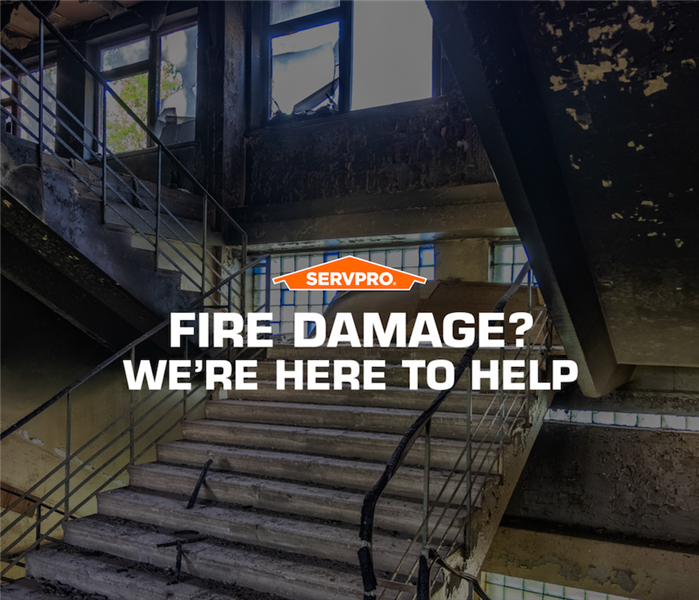 SERVPRO fire damage, we are here to help sign.