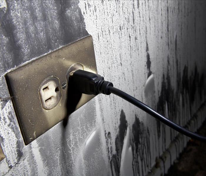 sooty wall, by socket, fire damage