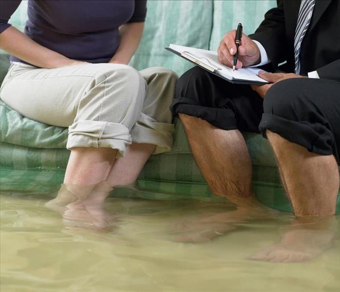 Feet in flooded waters